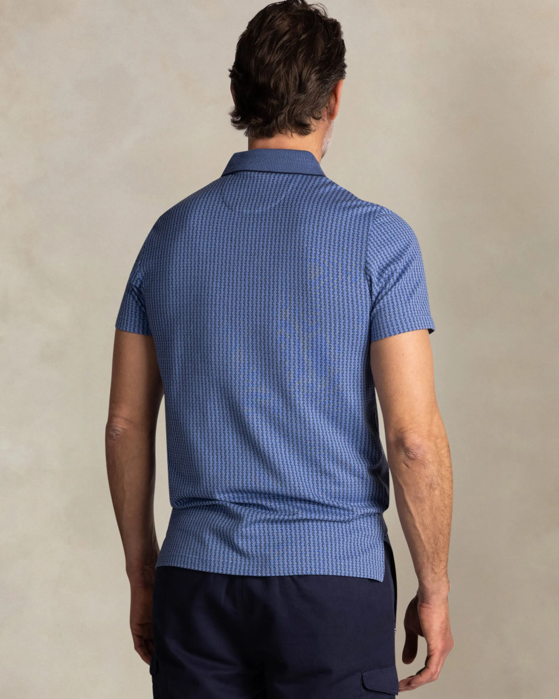 Blue polo with small white stripe