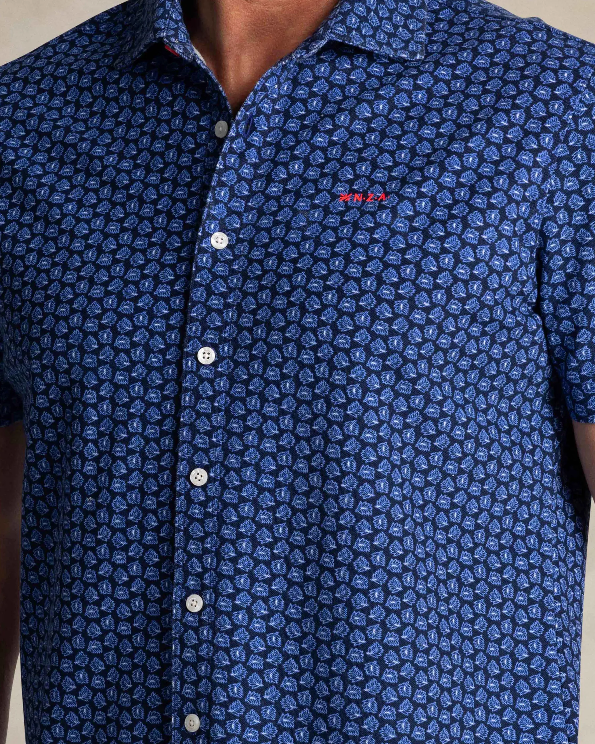 Blue shirt with small white dots