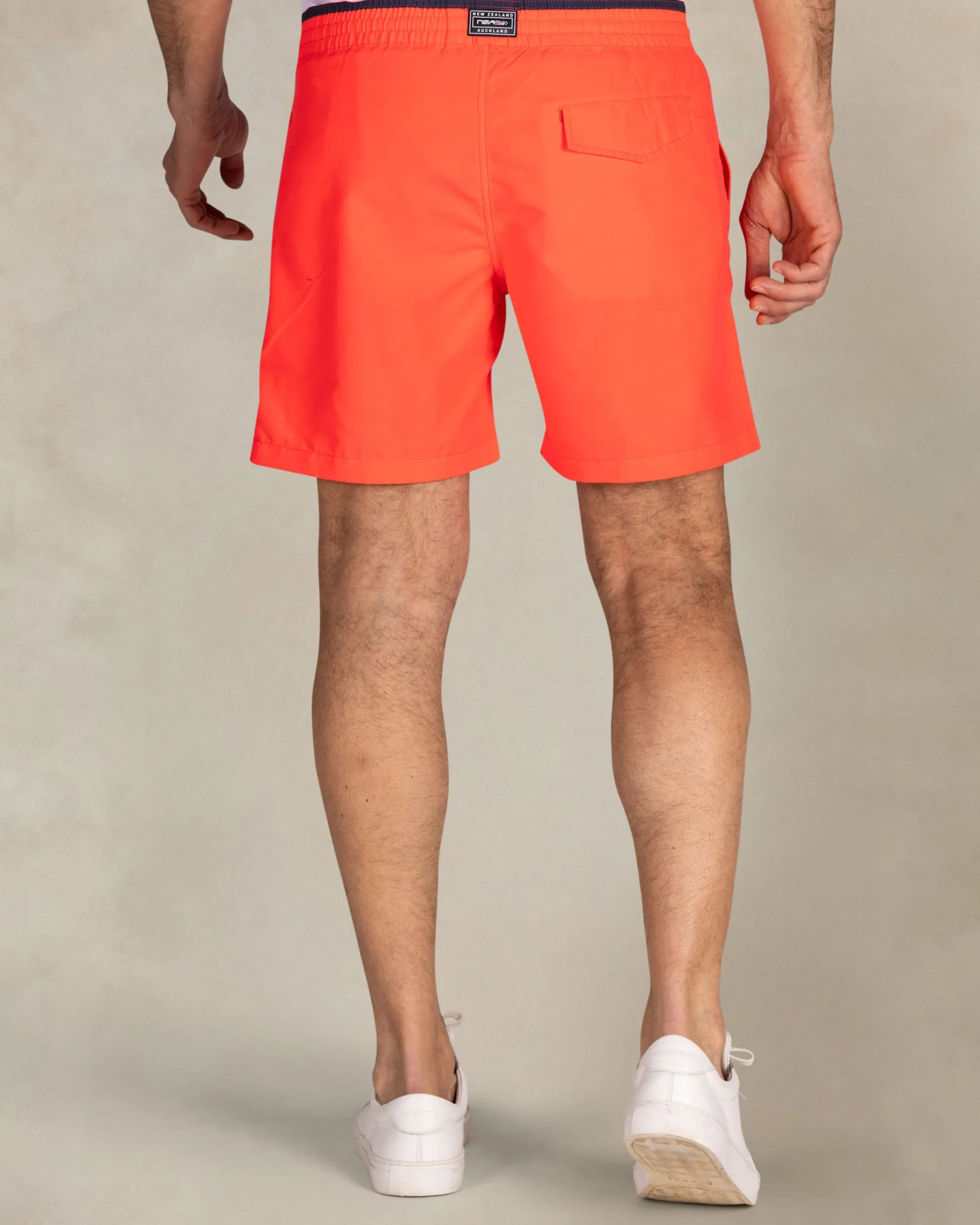 Bright red swim shorts with navy details