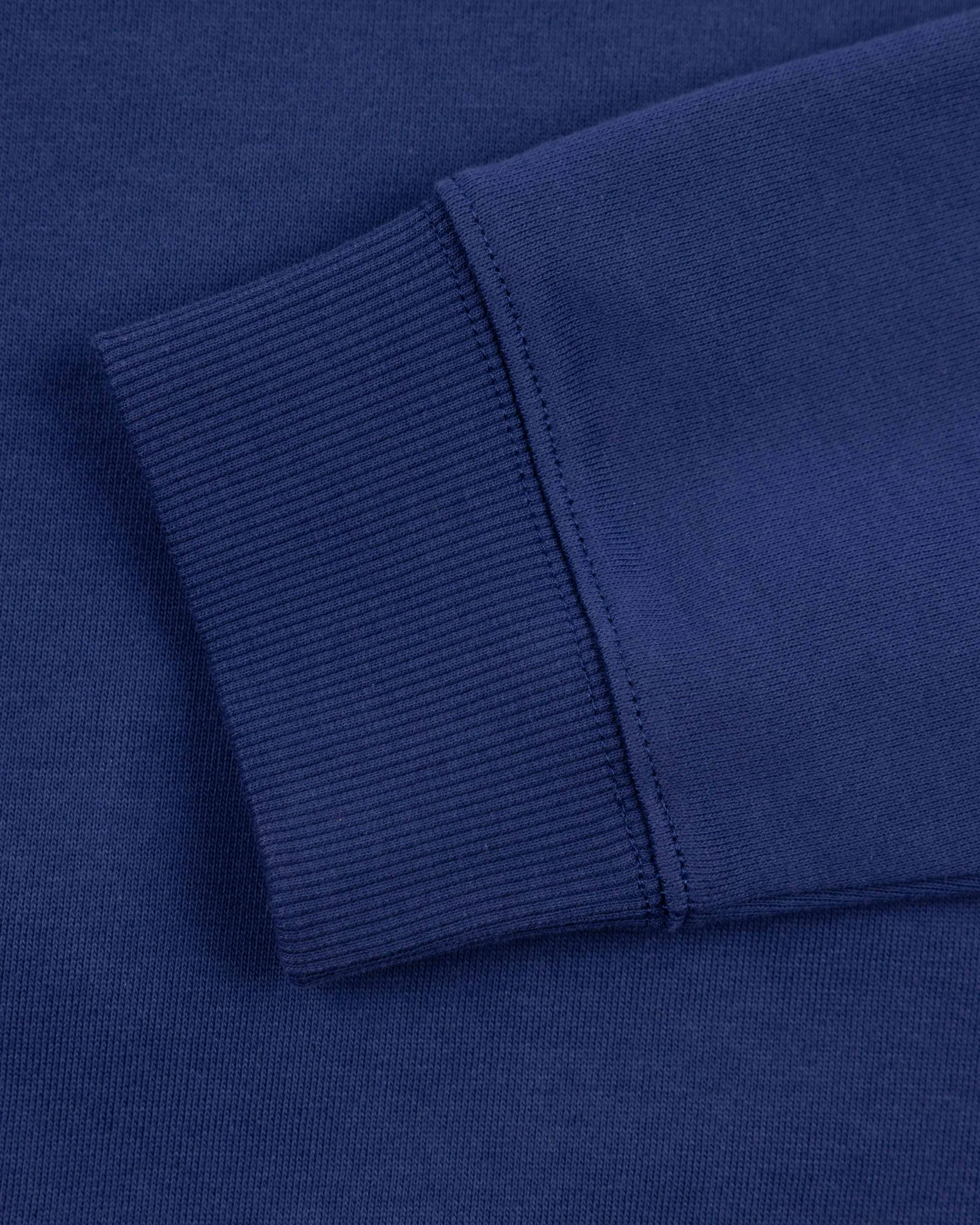 Dark blue sweater with light blue stripes