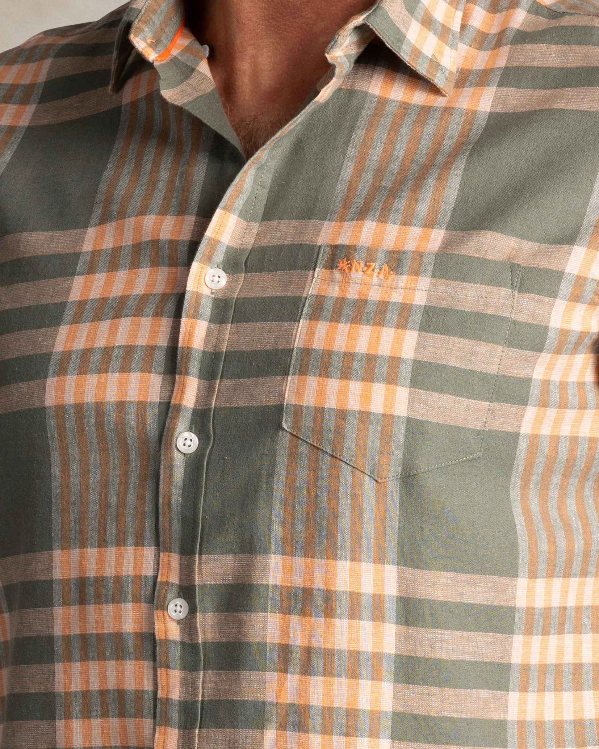Green and orange short-sleeve checkered shirt