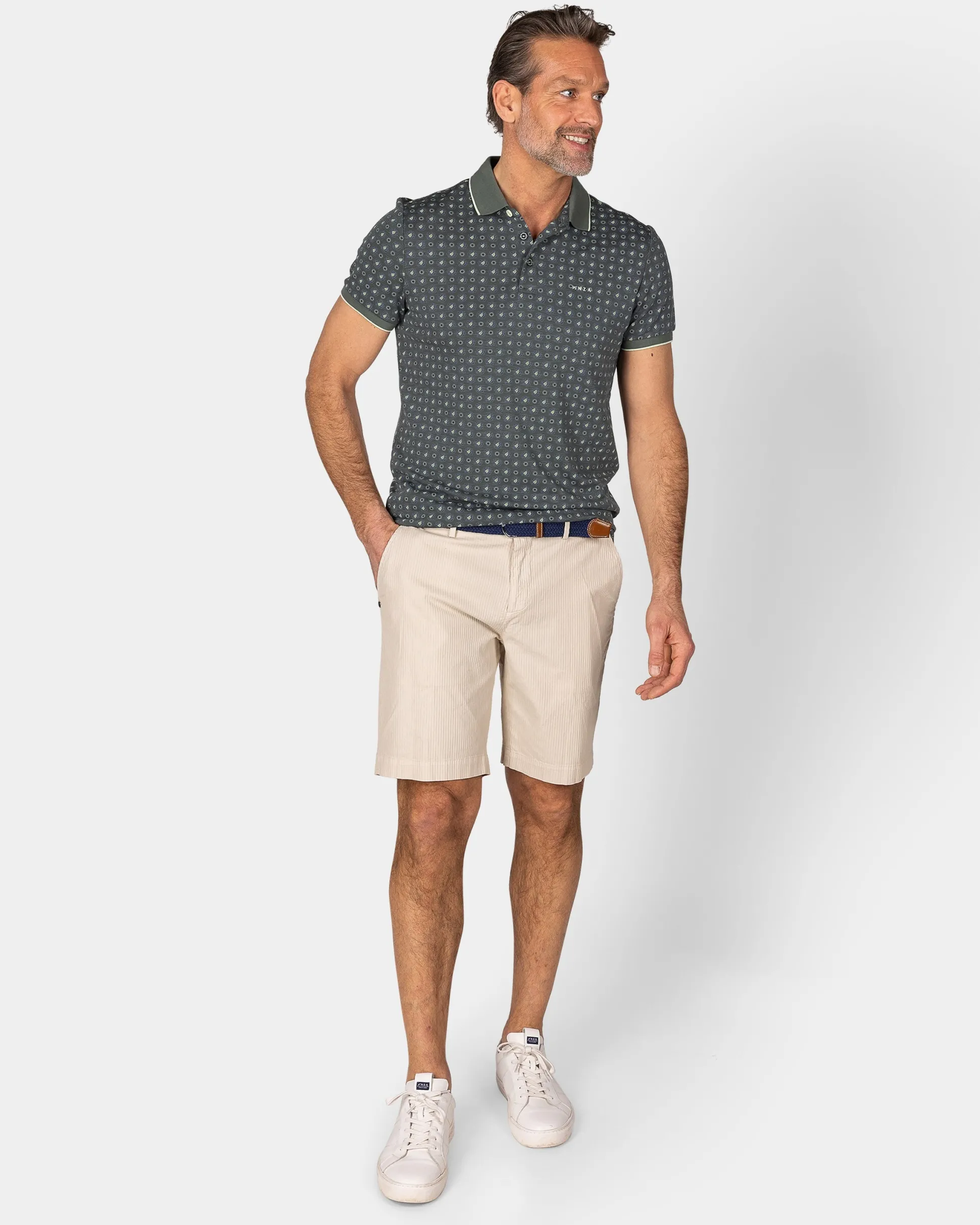 Green Polo with a print of small polka dots