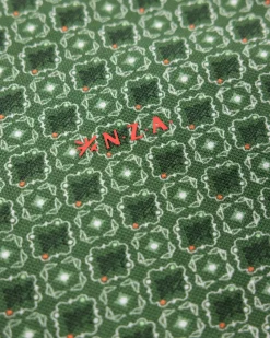 Green polo with dots