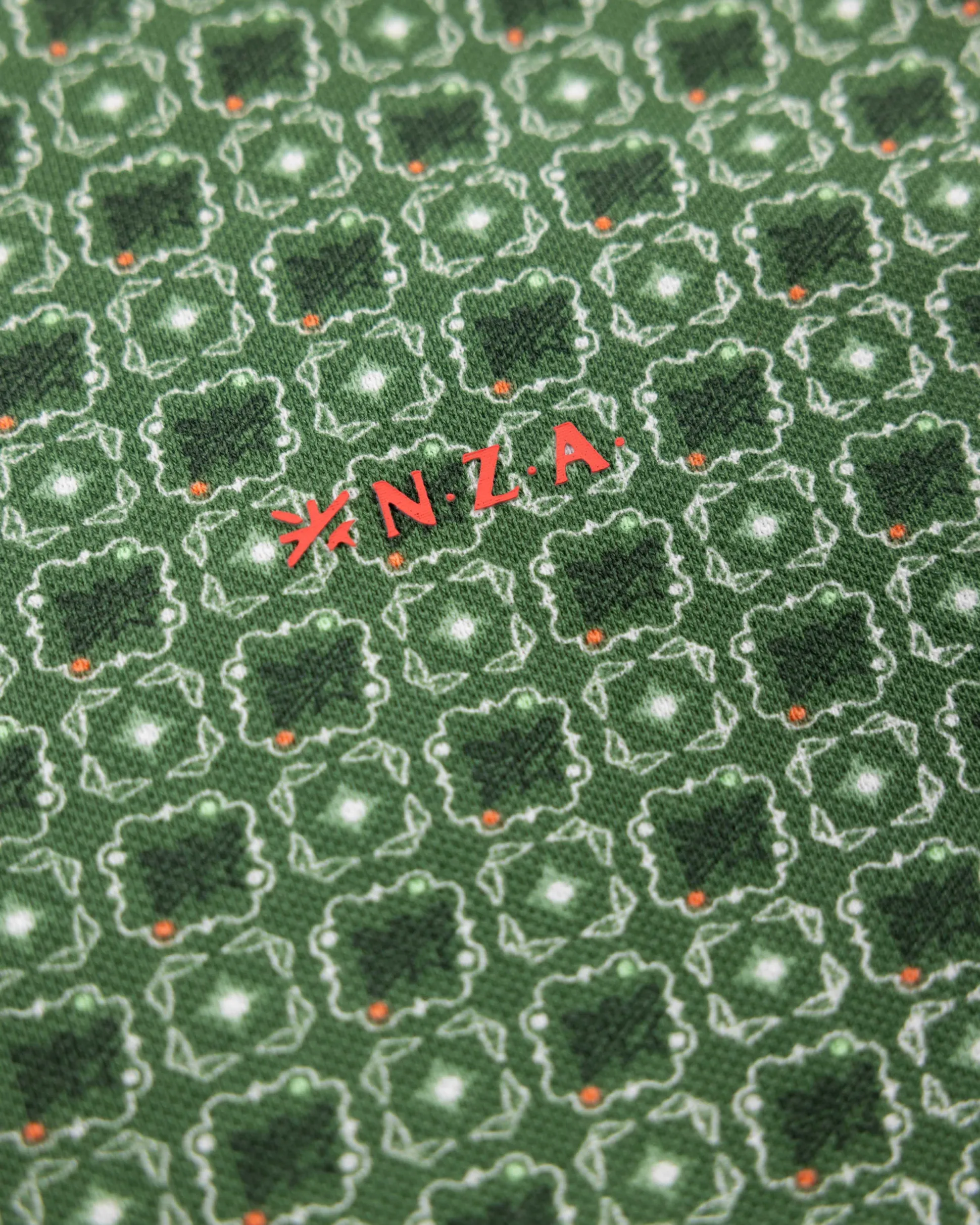 Green polo with dots