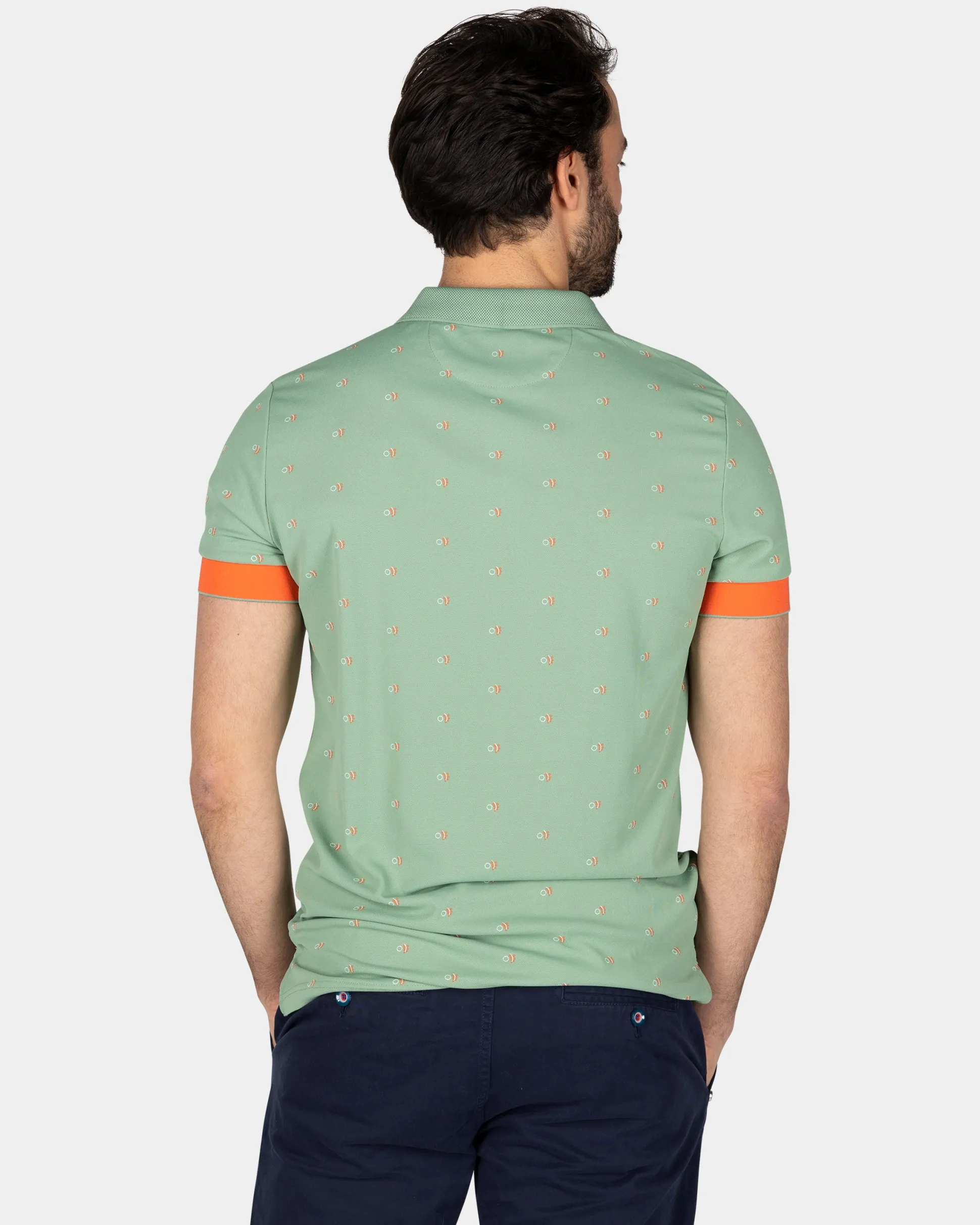 Green polo with orange accents
