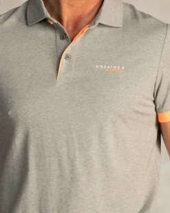 Green polo with orange details
