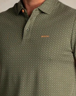 Green polo with small orange dots