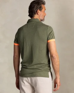 Green polo with small orange dots