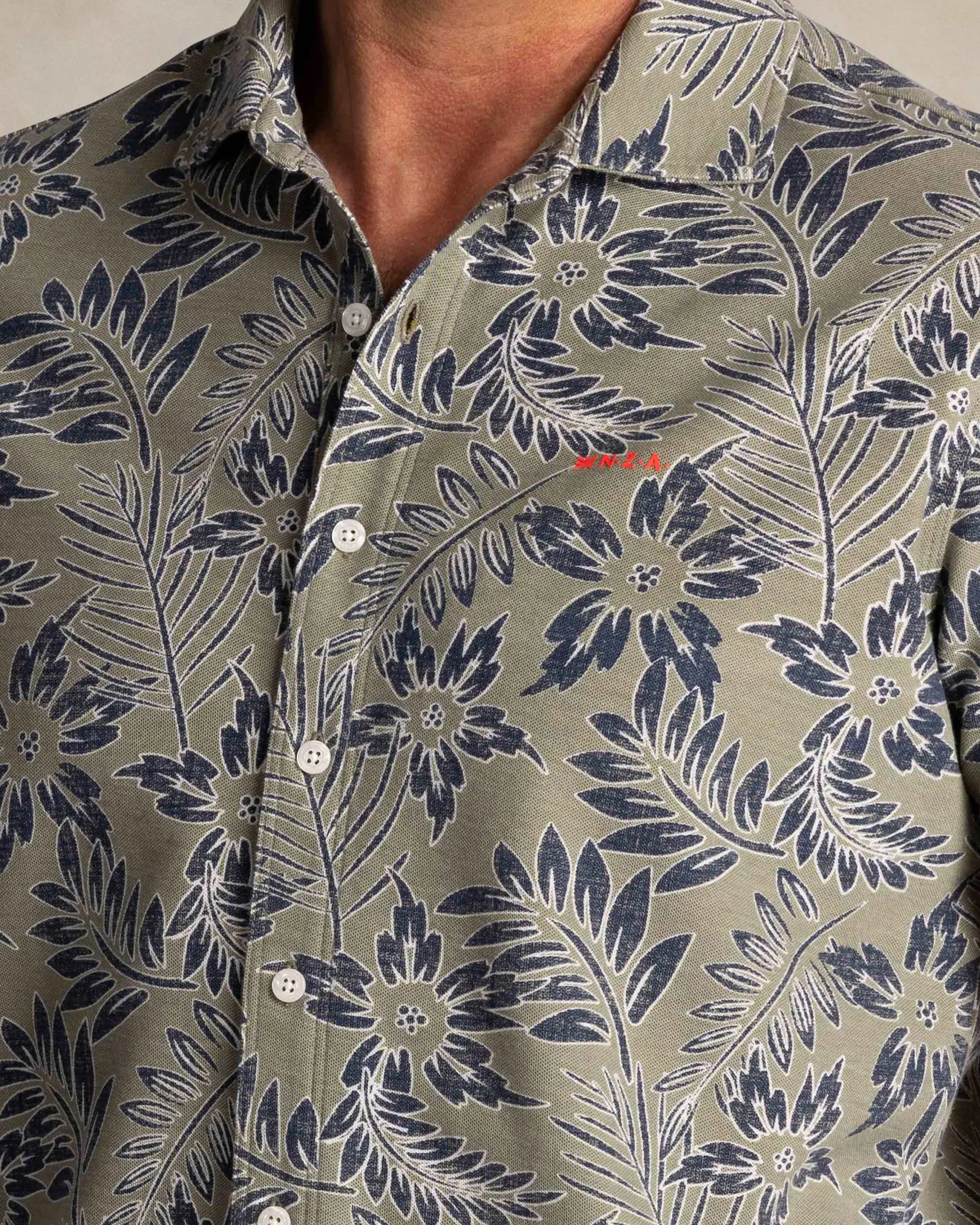 Green shirt with blue and white leaf print