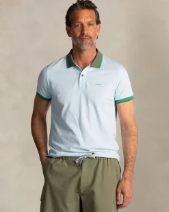 Light blue cotton polo with green collar