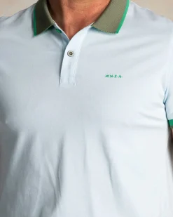 Light blue cotton polo with green collar