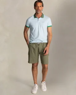 Light blue cotton polo with green collar