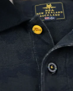 Navy polo shirt with leaf print