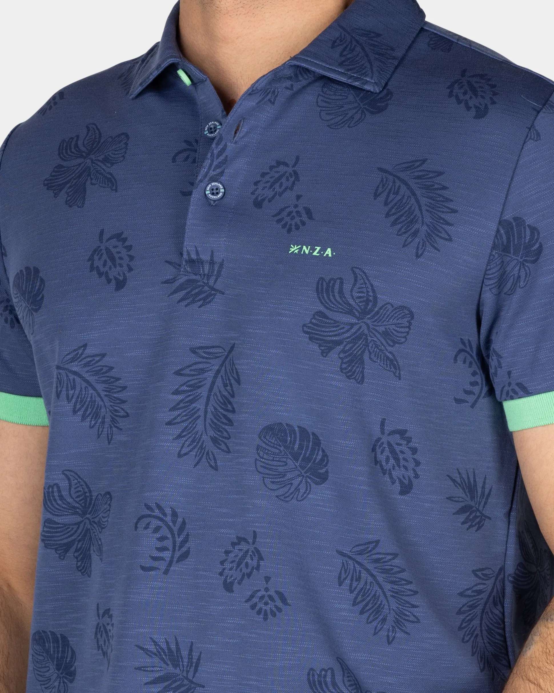 Navy polo shirt with leaf print