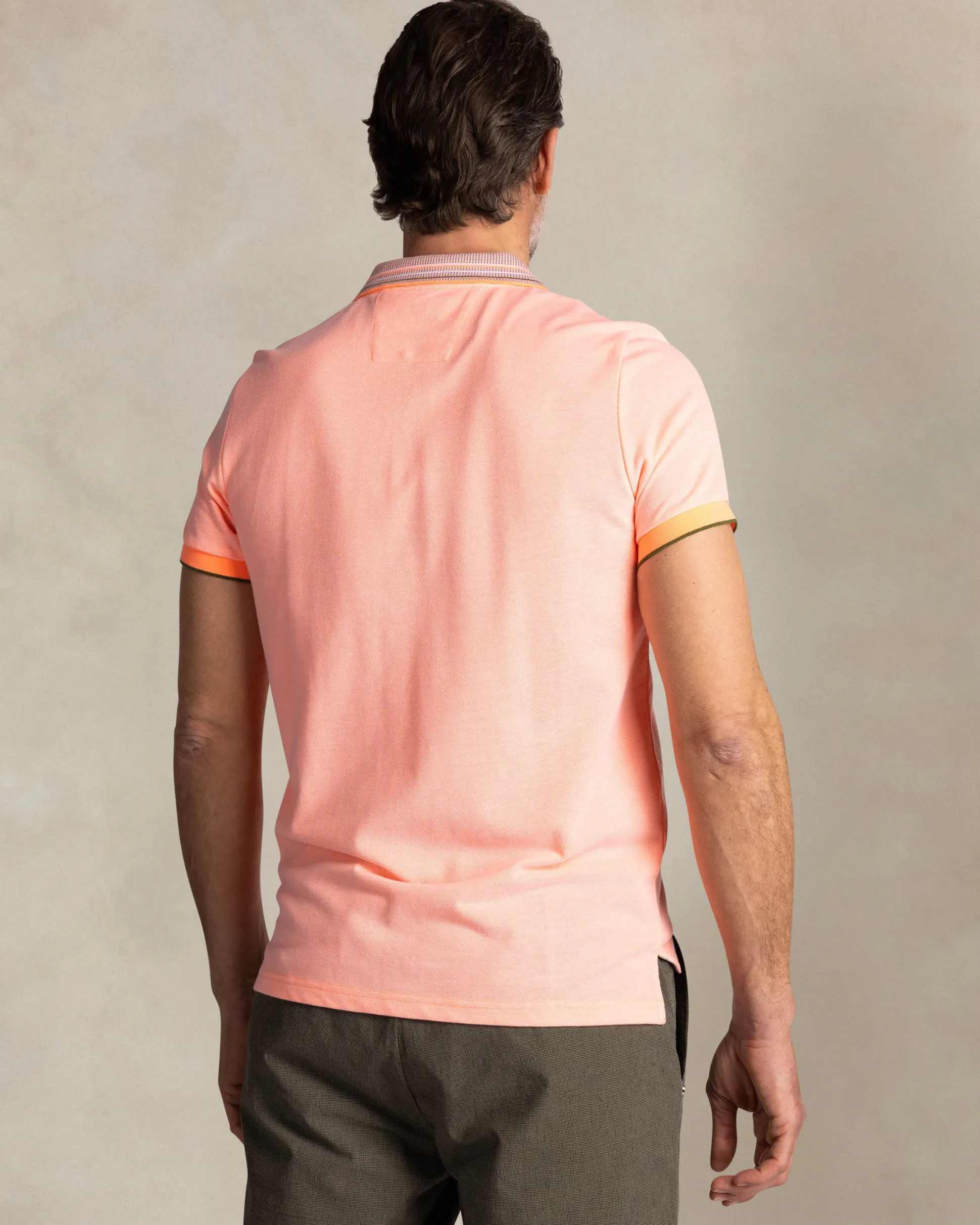 Orange polo with striped collar