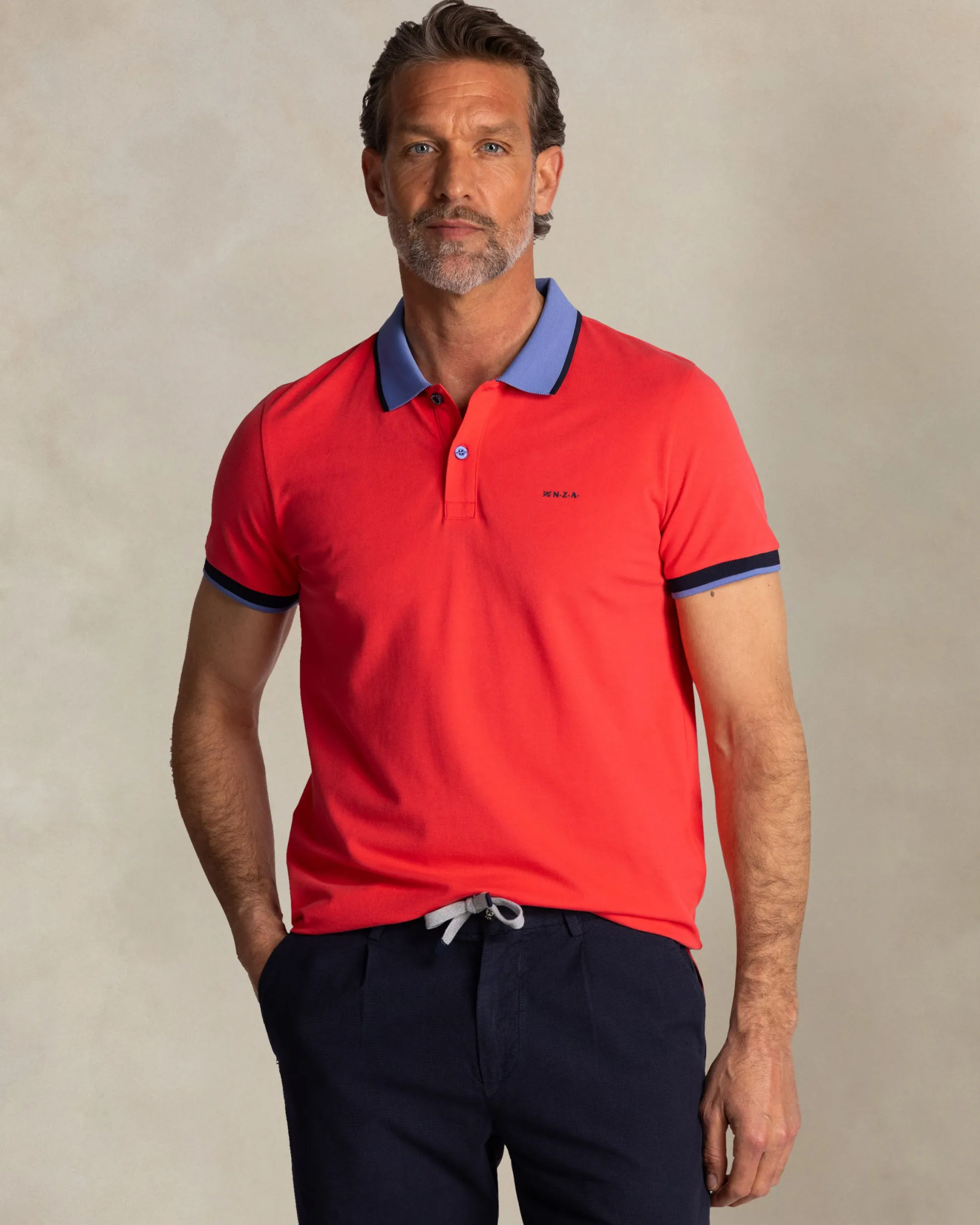 Red cotton polo with blue collar