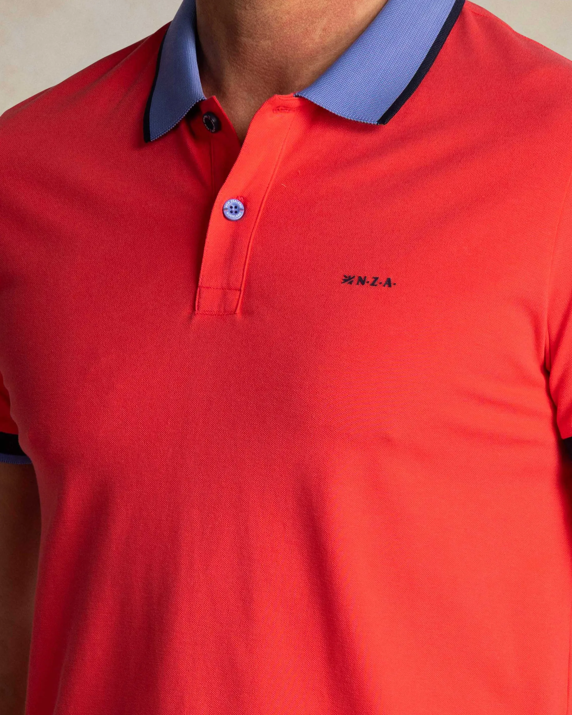 Red cotton polo with blue collar