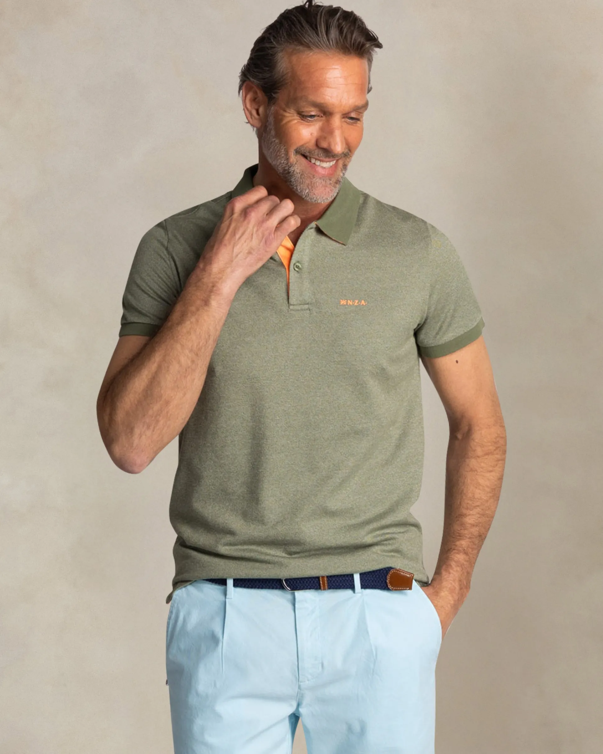 Solid green polo with orange details