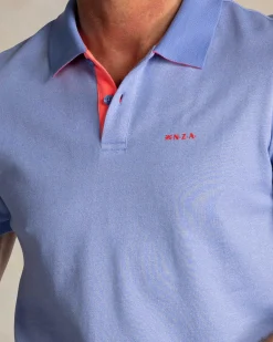 Solid light blue polo with orange details