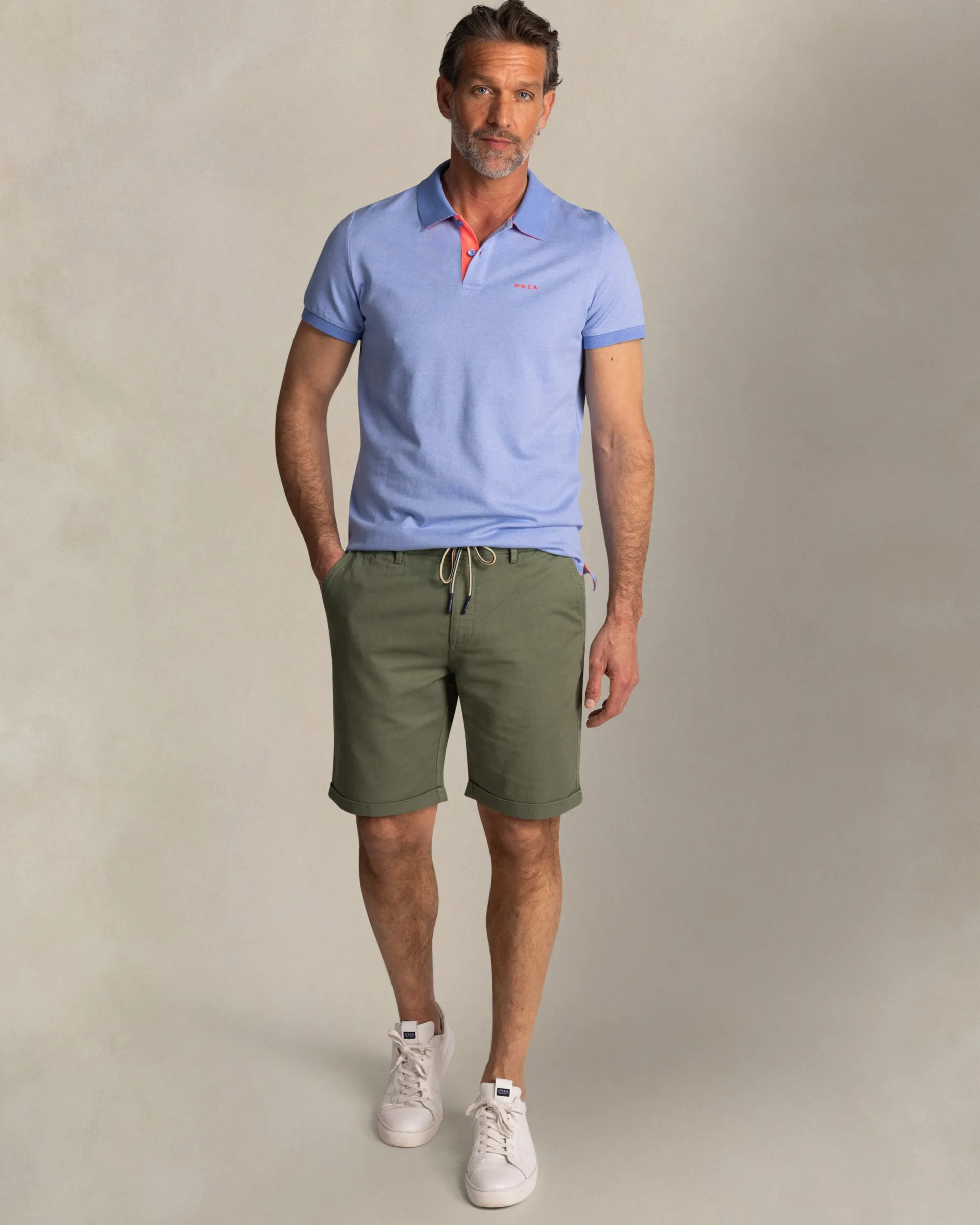 Solid light blue polo with orange details