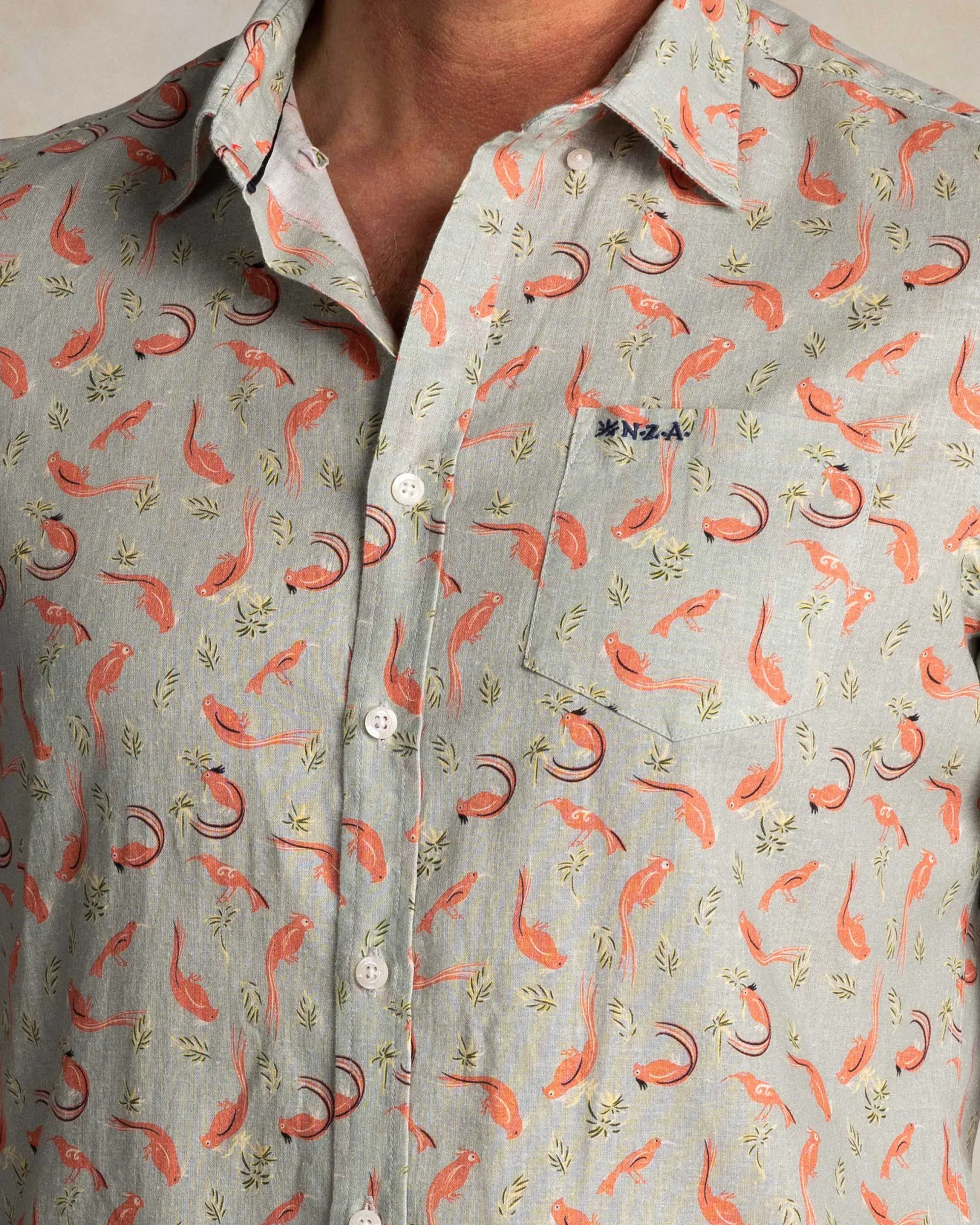 Taupe shirt with orange graphic print