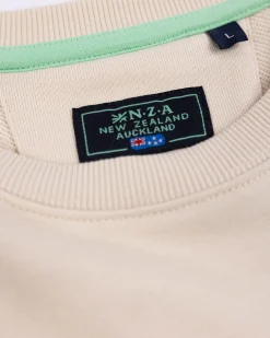 White sweater with light blue stripes