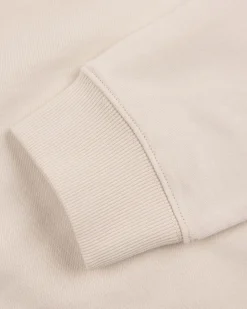 White sweater with light blue stripes