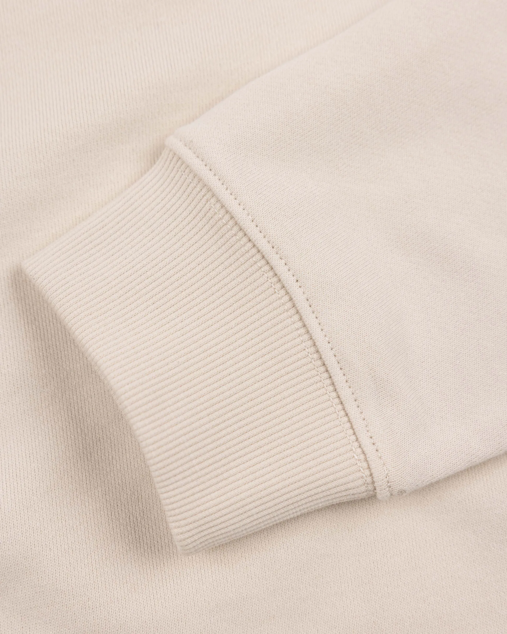 White sweater with light blue stripes